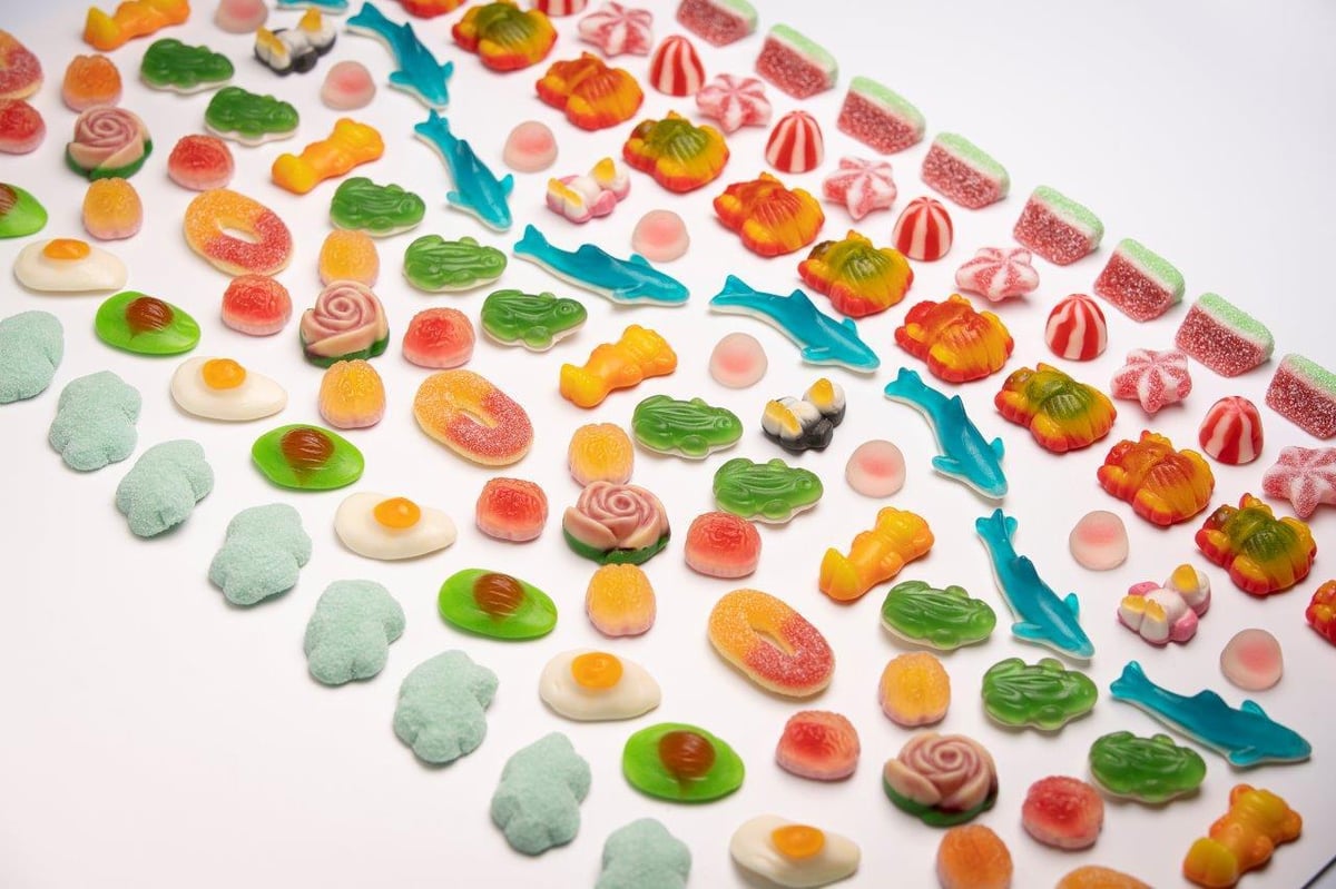 Assortment of colorful candy and sweets representing packaged confectionery products.