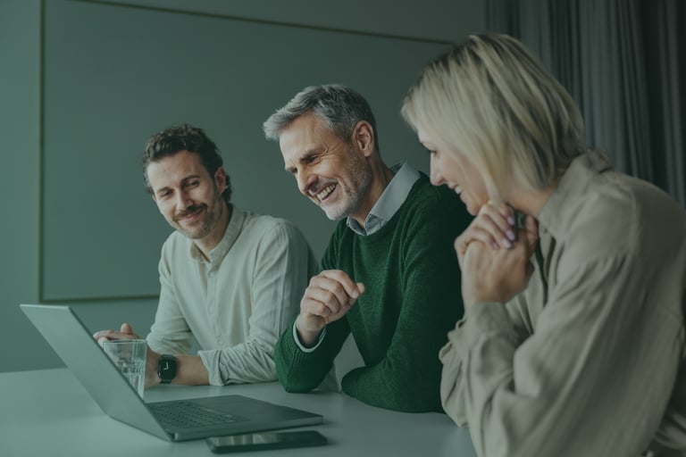 Syntegon employees collaborating during a meeting
