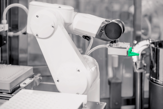 Robotic arm with compliance-ready design handling RTU components in a high-precision pharmaceutical filling line