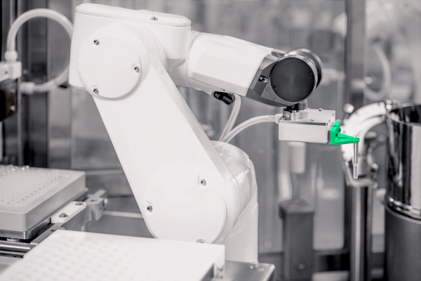 Robotic arm with compliance-ready design handling RTU components in a high-precision pharmaceutical filling line