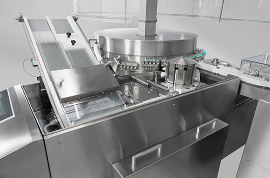 Stainless steel pharmaceutical equipment for automated cleaning of glass ampoules, integrated into the sterile processing line before ampoule filling machine operations.